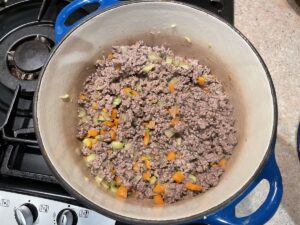 Stir mince with carrots and celery