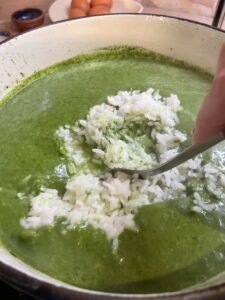 stir rice into spinach soup